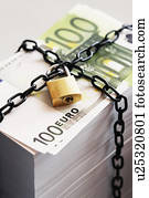 Stack of Euros secured by padlock and chain