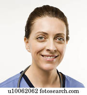 Head shot portrait of Caucasian woman doctor smiling against white background. Head shot portrait of Caucasian woman doctor smiling against white background.