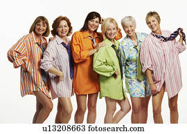 Portrait of a group of mature women standing together and smiling Stock