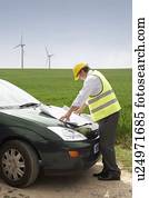 Man with plans on a wind farm