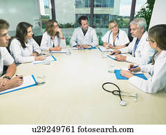 Group of doctors meeting in conference room.