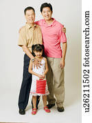 Portrait of a senior man with his son and granddaughter