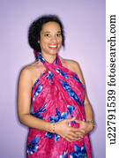 Expecting female with hands on stomach