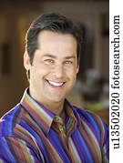 Mid adult man smiling at viewer