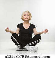 Woman sitting in yoga position