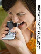 Biting phone and making facial expression