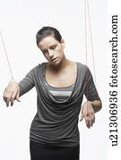 Mid adult woman as marionette