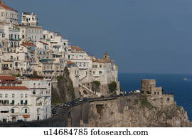 Town of Amalfi, showing coastal road and promontory fort, with blue sea and sky beyond