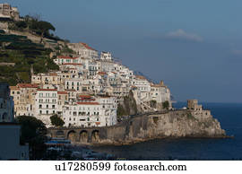 Town of Amalfi, showing coastal road and promontory fort, with blue sea and sky beyond