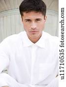 Portrait of a man with dark hair, looking to camera