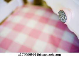 Detail Pink Drawer Knob Over Pink Gingham Chair Cushion Picture