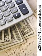 Still life of US money and calculator