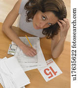 Woman working against tax deadline