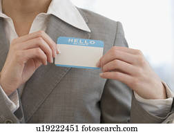 Businesswoman putting on Hello My Name Is sticker