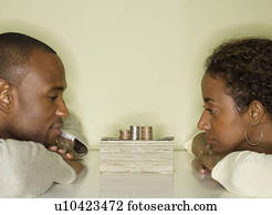 Couple looking at pile of money