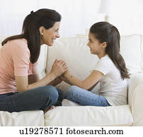 Mother and daughter smiling at each other