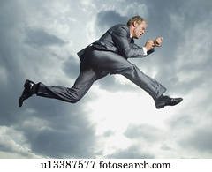 Low angle view of businessman jumping