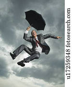 Low angle view of businessman jumping