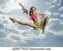 Low angle view of girl jumping