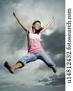 Low angle view of woman jumping