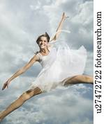 Low angle view of woman jumping