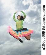 Low angle view of woman jumping