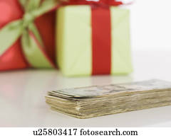 Studio shot of pile of money and gifts