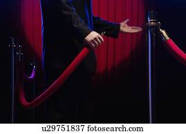 Bouncer unhooking velvet rope