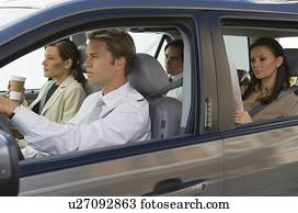 Business people car pooling