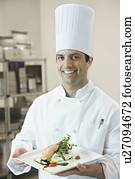 Chef presenting gourmet entree Chef presenting gourmet entree