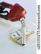 Close up of gas pump and money