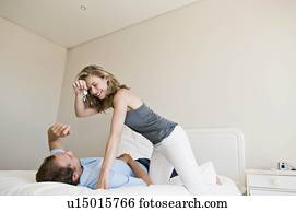 A couple in their bedroom. A couple in their bedroom.