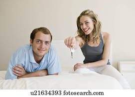 A couple in their bedroom. A couple in their bedroom.