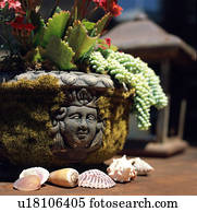 Centerpiece with carved face