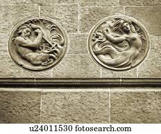 Stone wall with carved out mermaid and Poseidon at Santa Barbara Courthouse