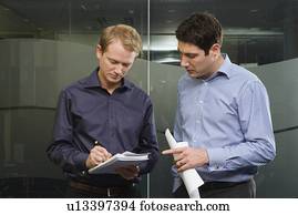 Two men discussing work