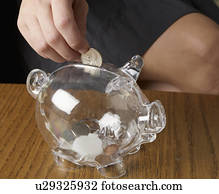 Person Saving Money in Piggy Bank