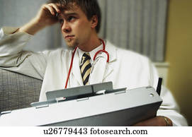 Doctor on couch with patient history binder