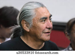 Senior man with long gray hair