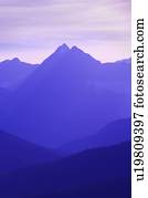 Hazy layered mountain scene  