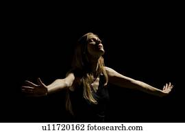 Woman holding arms out 