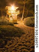 A lifeguard hut on the beach at night