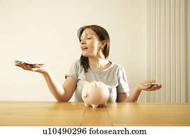 woman balancing money