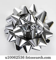 Still life of big shiny silver Christmas bow.