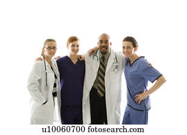 Half-length portrait of African-American man and Caucasian women medical healthcare workers in uniforms with arms around eachother standing against white background.