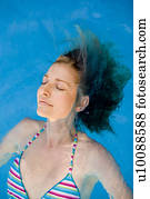 Woman swimming in pool