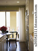 Chair at Dining Room Table with Sliding Glass Door in Background Chair at Dining Room Table with Sliding Glass Door in Background