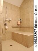Beautiful shower in an exquisite home featuring universal design - totally accessible shower for those requiring roll-in access and for those without disabilities need no special accommodations. Beautiful shower in an exquisite home featuring universal design - totally accessible shower for those requiring roll-in access and for those without disabilities need no special accommodations.