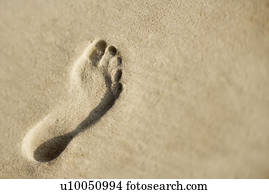Footprint in sand.